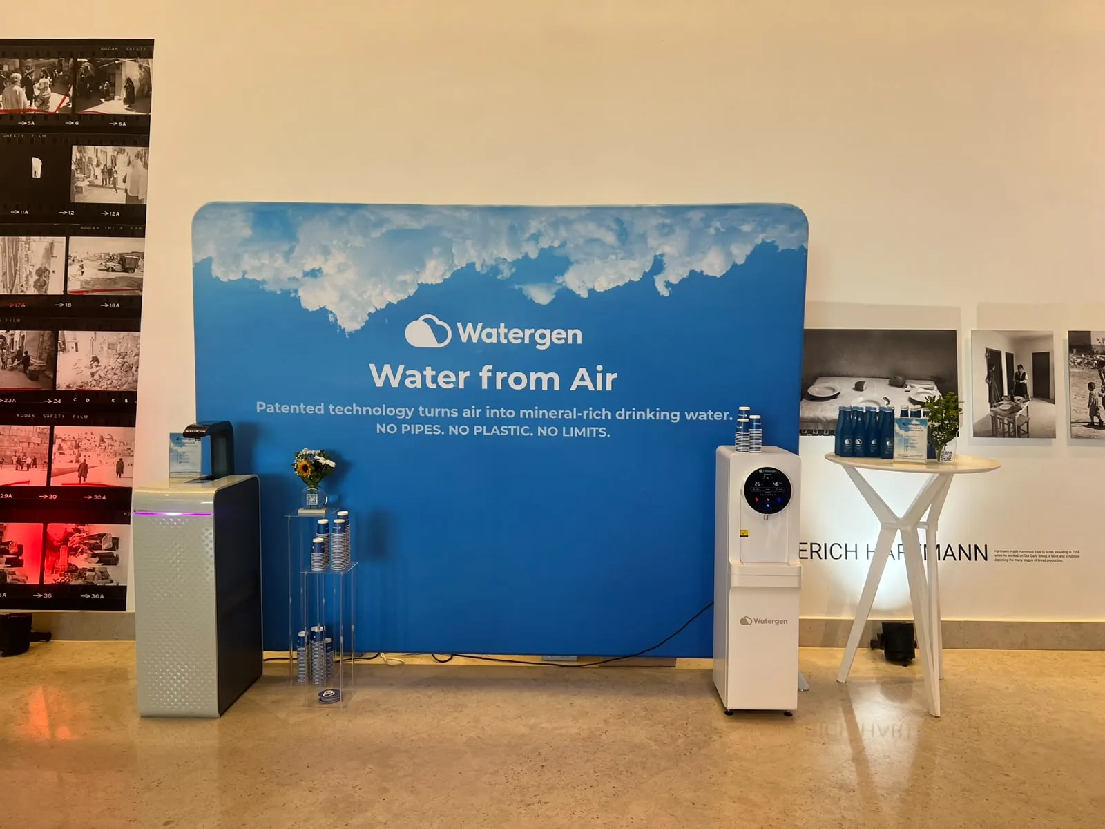 The Watergen stand at the Freedom 250 Celebration: the “Water from Air” wall with two generators and stacked cups