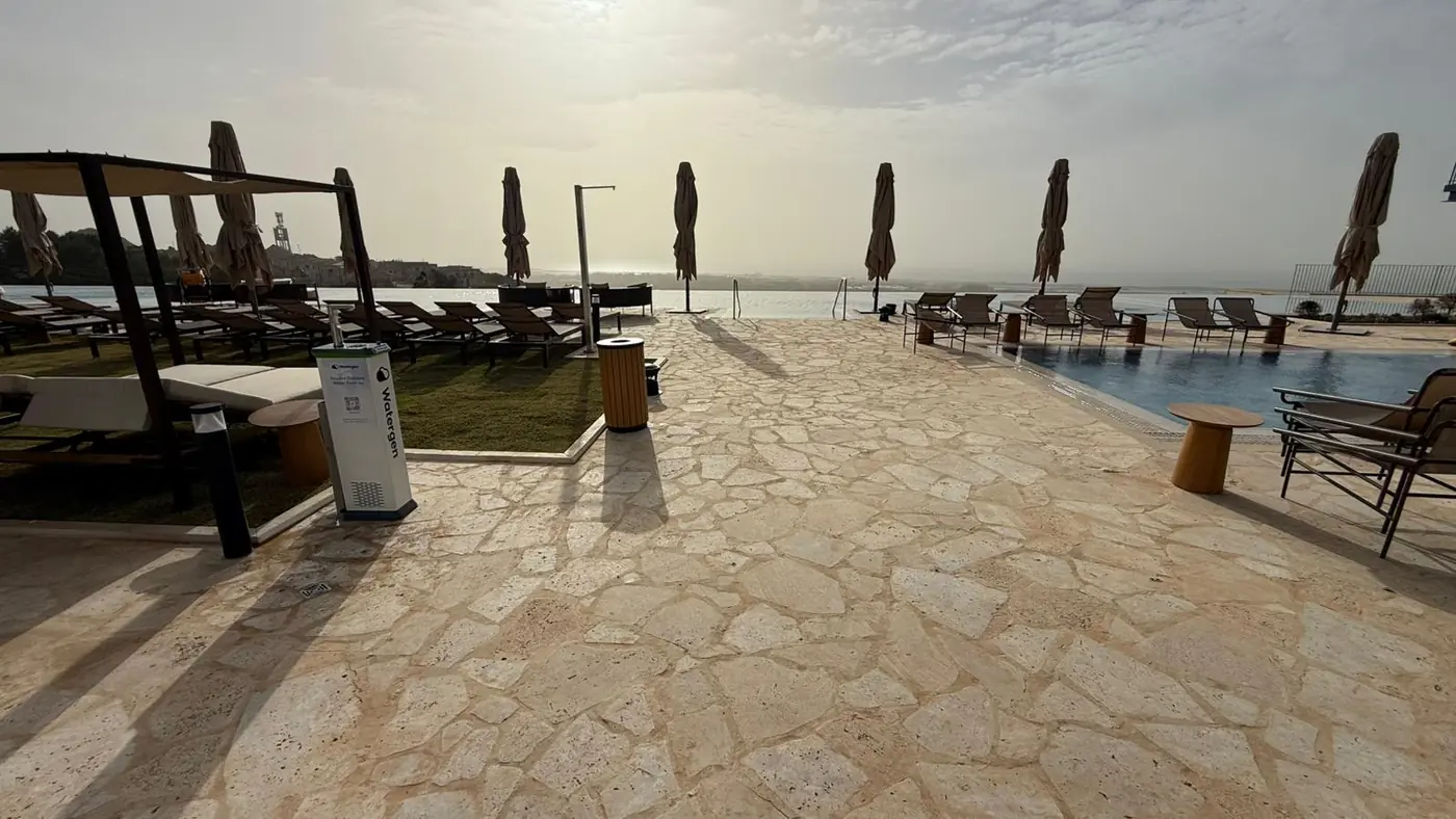 A Watergen dispenser on the sea-view terrace at Gordonia at sunset