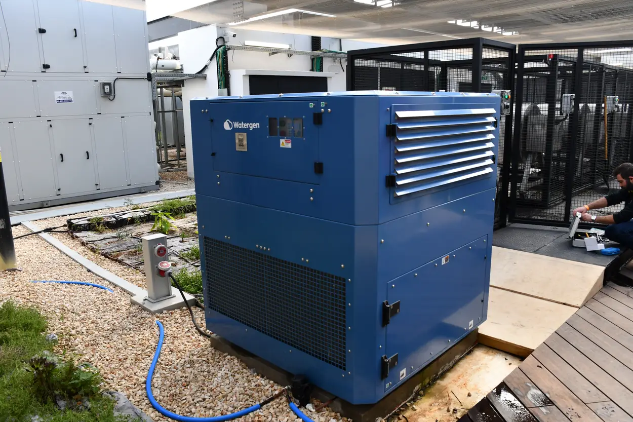 A Watergen atmospheric water generator installed in the rooftop plant area of the Microsoft green campus