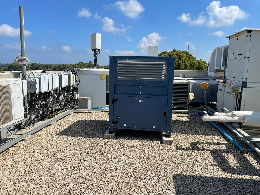 A Watergen atmospheric water generator installed on a campus rooftop