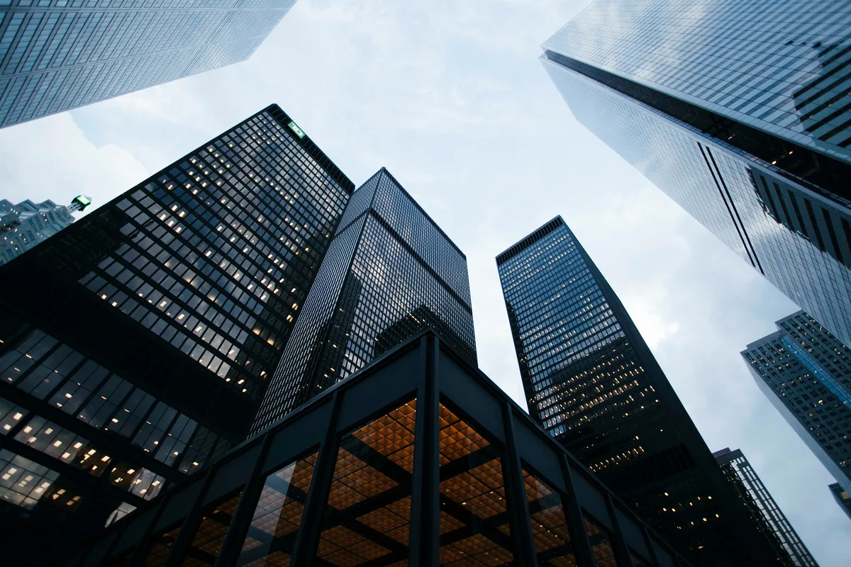 Glass office towers seen from street level