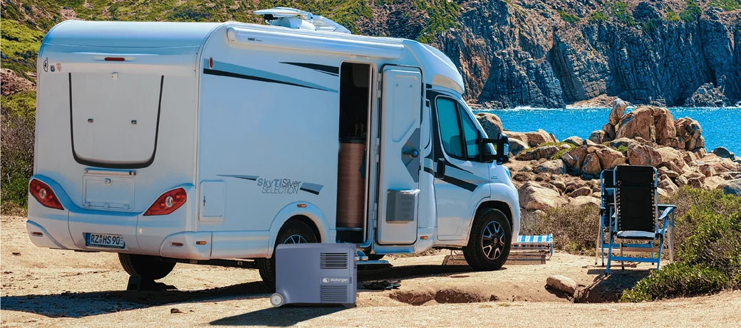 Mobile Box beside a campervan parked over the sea